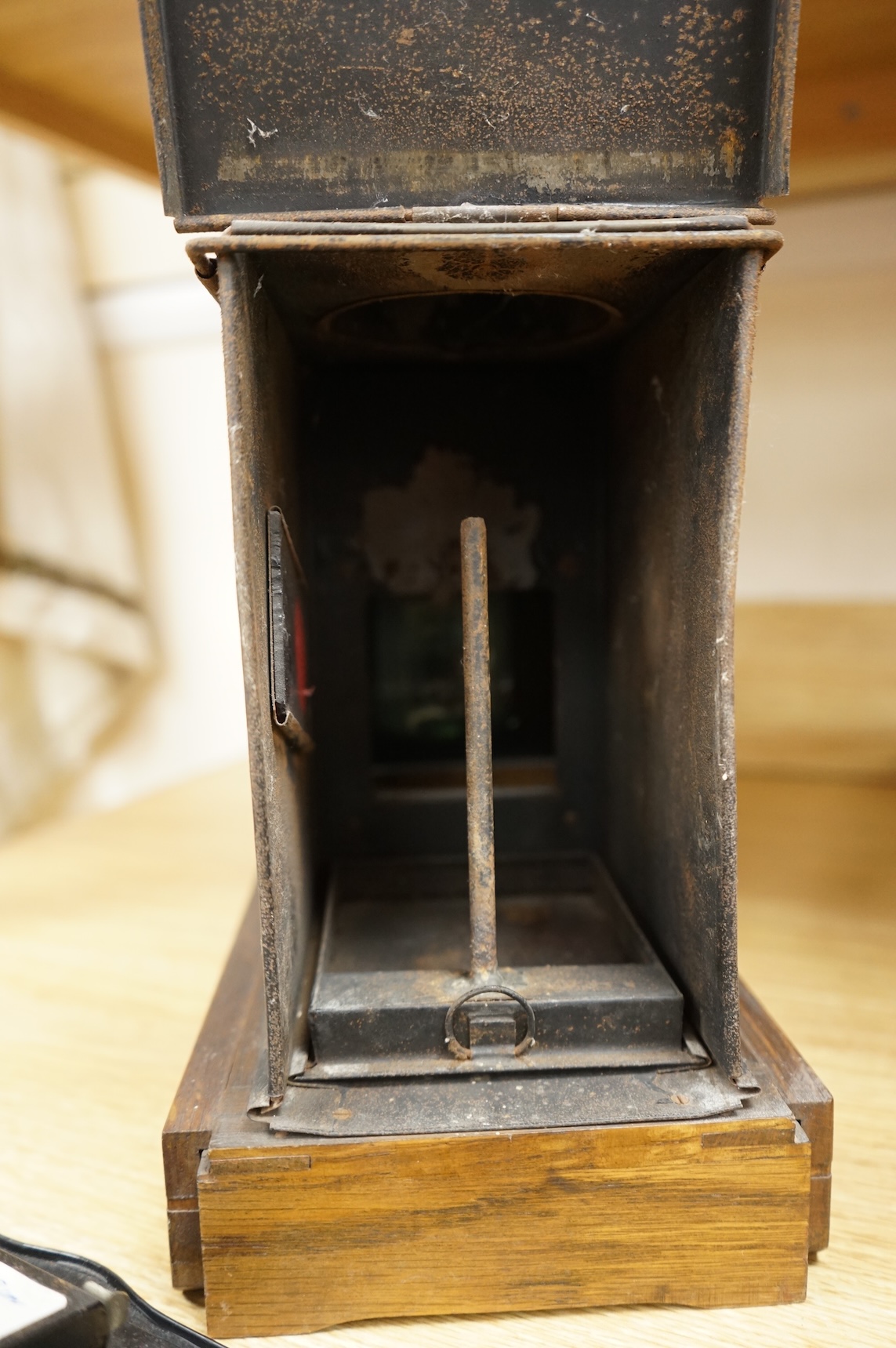 A late 19th century mahogany and tinplate magic lantern style horizontal photograph enlarger, together with some related items.